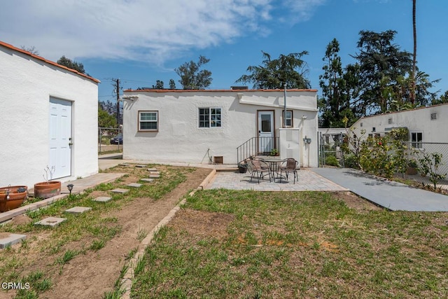 3059 Glenrose Ave, Altadena, CA 91001 - back of property featuring stucco siding, a patio area, a lawn, and fence