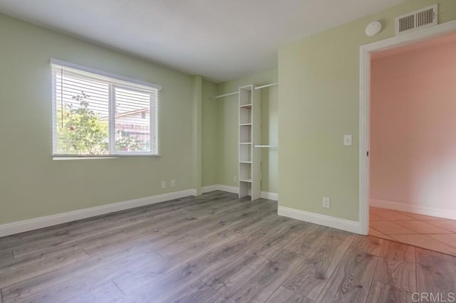 1030 Ball Ave, Escondido, CA 92026 - unfurnished bedroom with wood finished floors and baseboards