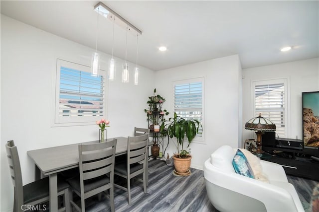 dining space featuring recessed lighting, wood finished floors, a wealth of natural light, and baseboards