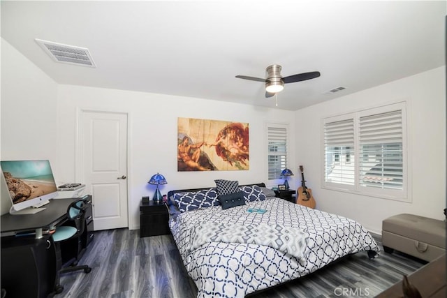 bedroom featuring ceiling fan, dark wood-style flooring, and visible vents