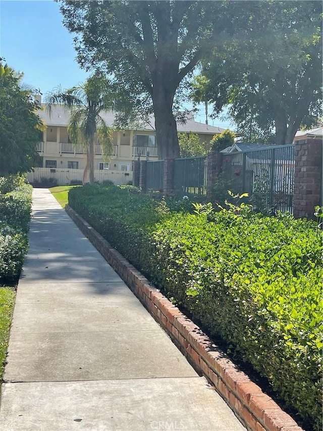 view of property's community featuring fence