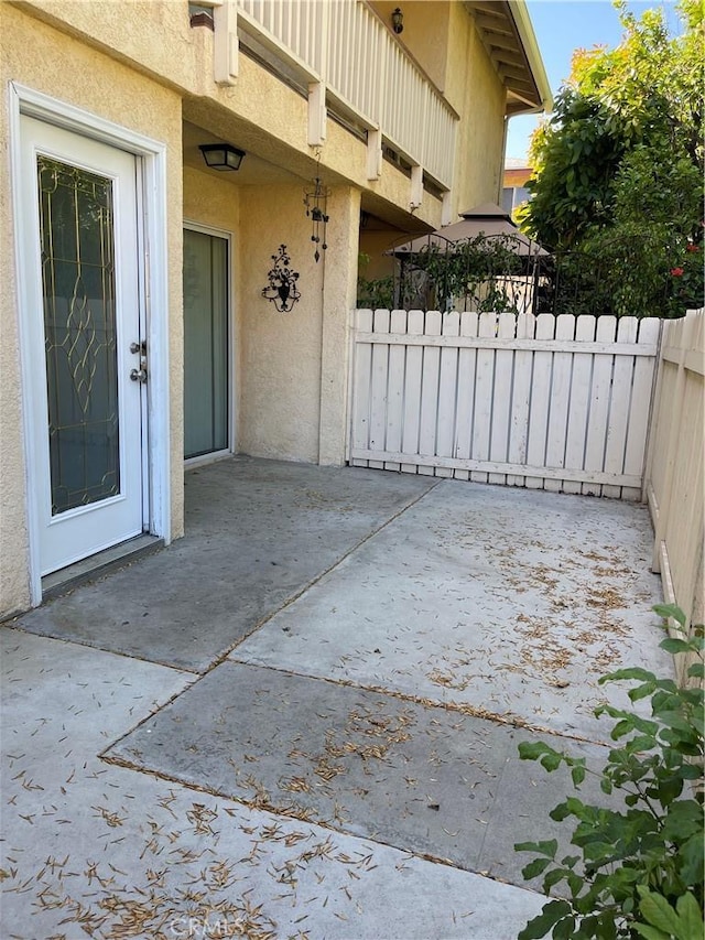 exterior space with a patio area and fence