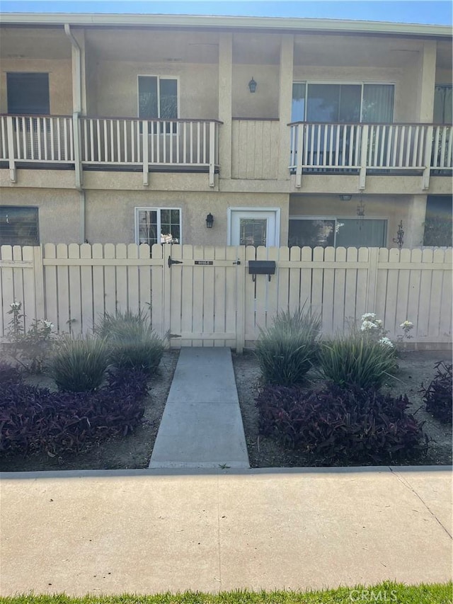 exterior space featuring a gate and fence private yard