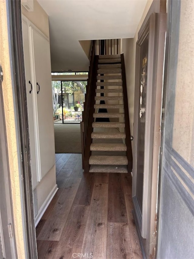 12750 Centralia St Unit 142, Lakewood, CA 90715 - stairway featuring hardwood / wood-style flooring