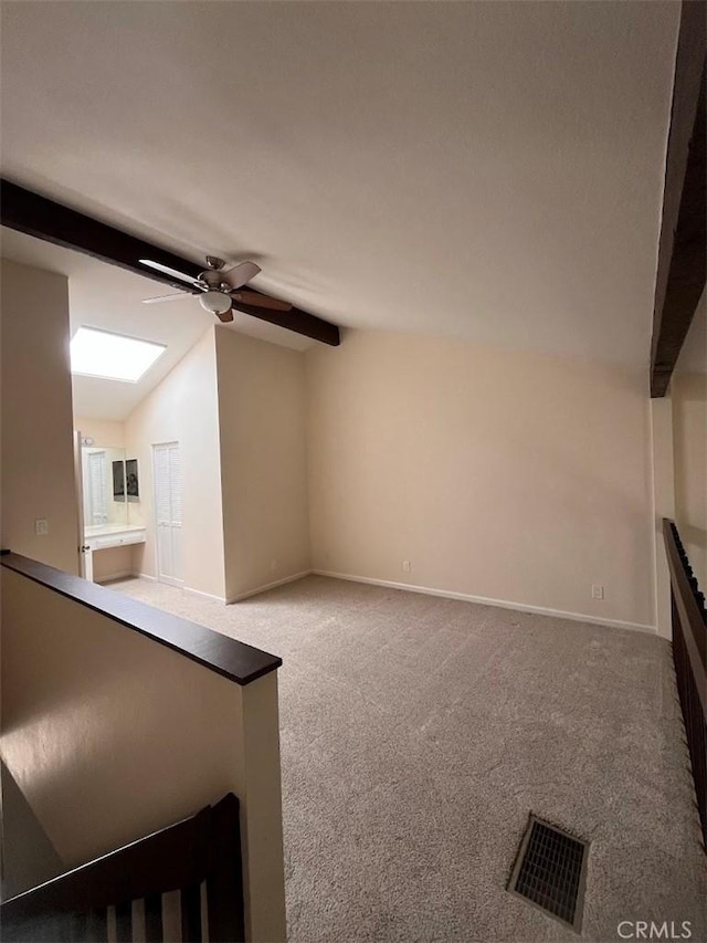 12750 Centralia St Unit 142, Lakewood, CA 90715 - unfurnished living room featuring vaulted ceiling, visible vents, carpet floors, and ceiling fan