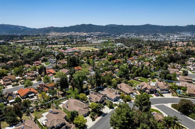birds eye view of property with a mountain view and a residential view