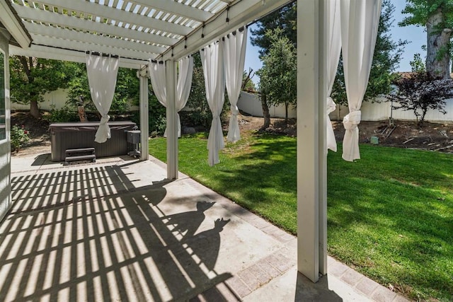 view of patio with a fenced backyard, a pergola, and a hot tub