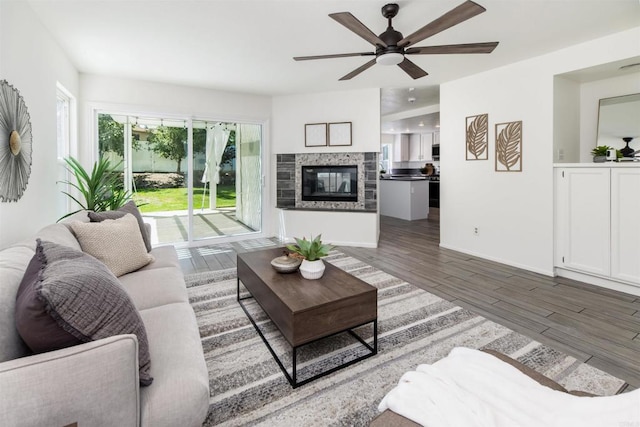 42059 Avenida Vista Ladera, Temecula, CA 92591 - living room with ceiling fan, wood finished floors, baseboards, and a glass covered fireplace