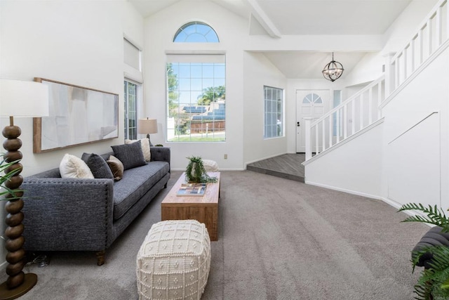 42059 Avenida Vista Ladera, Temecula, CA 92591 - carpeted living room with a chandelier, high vaulted ceiling, stairway, and baseboards
