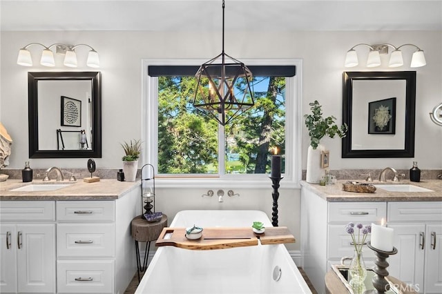 2121 Valhalla Dr, Santa Ana, CA 92705 - bathroom featuring two vanities, a freestanding tub, and a sink