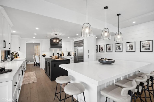 2121 Valhalla Dr, Santa Ana, CA 92705 - kitchen with a breakfast bar area, a center island, built in fridge, and recessed lighting