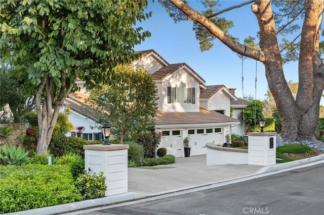 2121 Valhalla Dr, Santa Ana, CA 92705 - view of front of property with concrete driveway, an attached garage, and a tile roof
