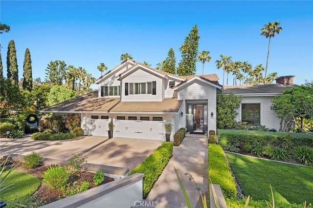 2121 Valhalla Dr, Santa Ana, CA 92705 - view of front of property featuring an attached garage and concrete driveway