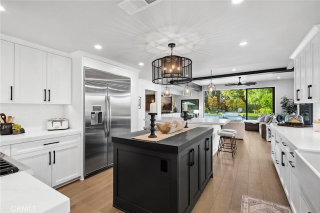 2121 Valhalla Dr, Santa Ana, CA 92705 - kitchen with recessed lighting, built in refrigerator, visible vents, and open floor plan