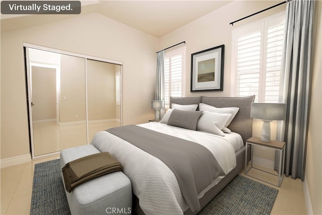 tiled bedroom featuring baseboards, lofted ceiling, and a closet