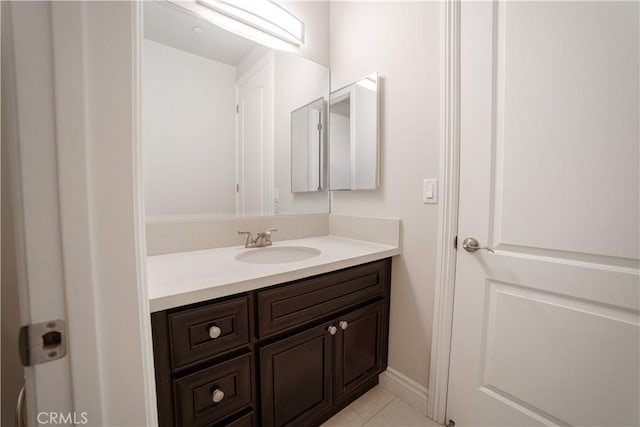 bathroom with tile patterned flooring and vanity