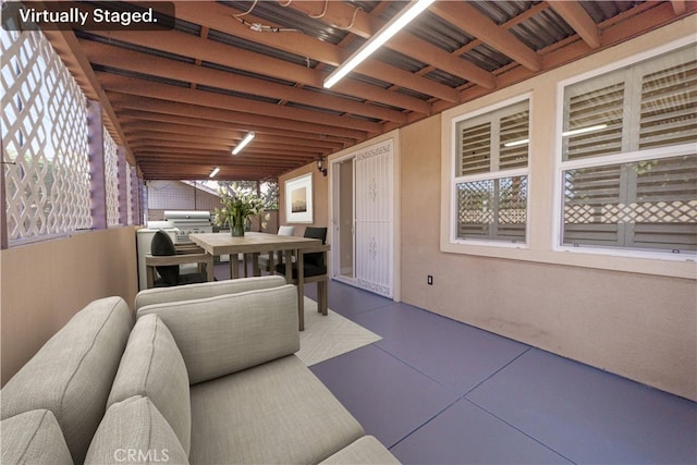 view of patio with area for grilling and outdoor dining space