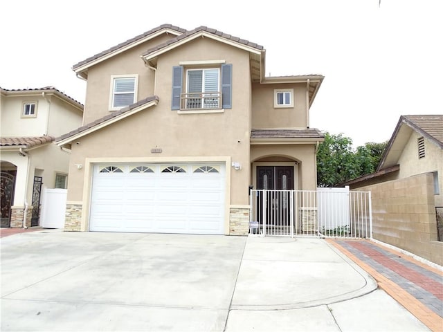 view of front of property with fence, stone siding, a garage, stucco siding, and driveway