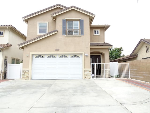 traditional-style house with fence, stone siding, stucco siding, an attached garage, and driveway