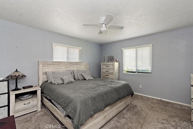 carpeted bedroom featuring a textured ceiling, baseboards, and ceiling fan