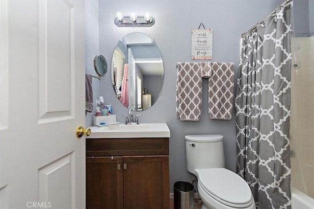 full bathroom featuring shower / bath combo, vanity, and toilet