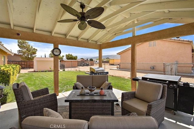 view of patio featuring a fenced backyard, a grill, an outdoor living space, and ceiling fan
