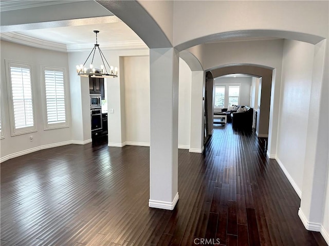 dining room featuring baseboards, a chandelier, and dark wood-type flooring