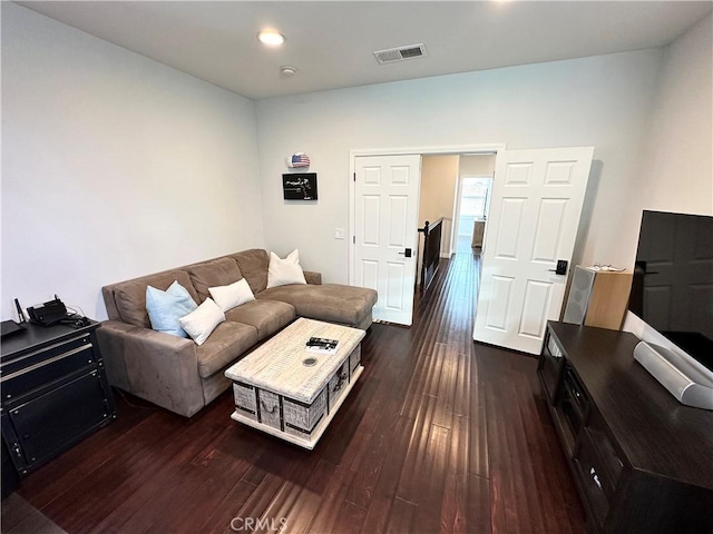 living room featuring recessed lighting, visible vents, and dark wood-style floors