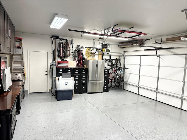 garage featuring freestanding refrigerator