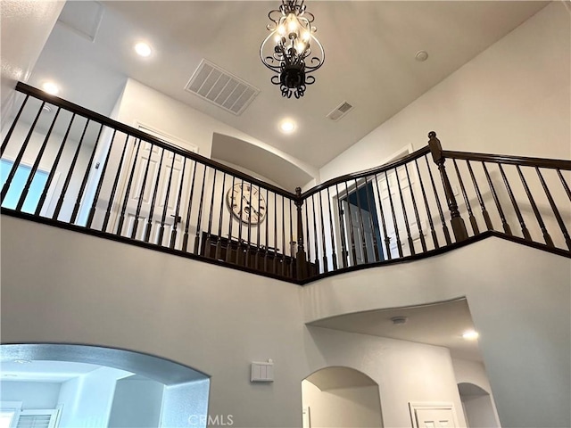 34036 Galleron St, Temecula, CA 92592 - stairway featuring high vaulted ceiling, recessed lighting, and arched walkways