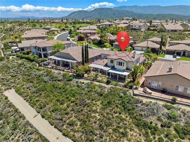 bird's eye view with a residential view and a mountain view