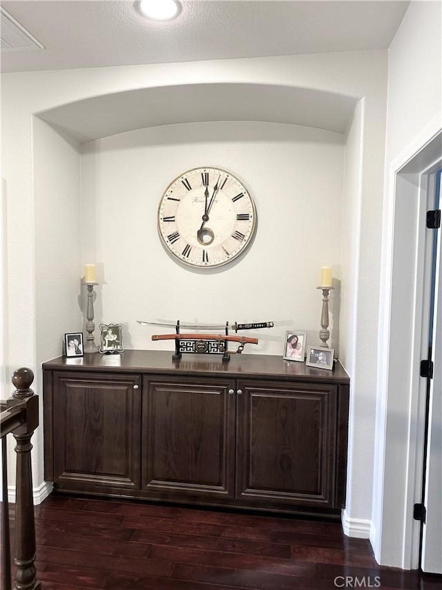 bar with dark wood-style floors