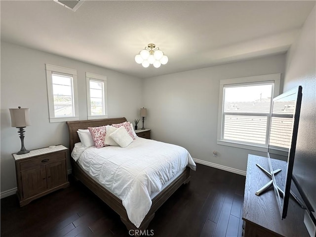 34036 Galleron St, Temecula, CA 92592 - bedroom with multiple windows, dark wood-style flooring, and a chandelier