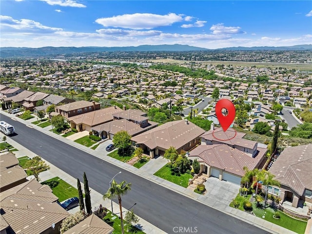 birds eye view of property with a mountain view and a residential view
