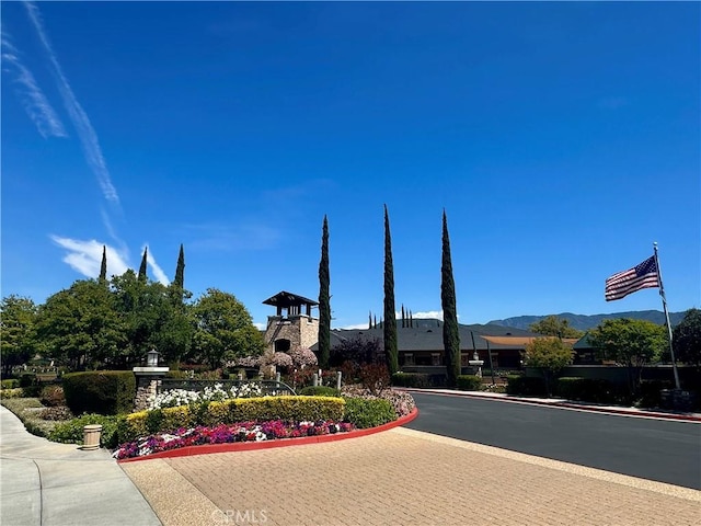 exterior space featuring curbs and sidewalks