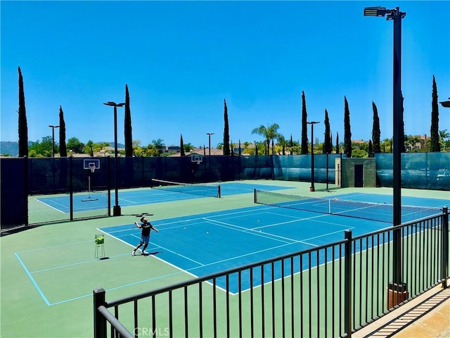 view of sport court with fence and community basketball court