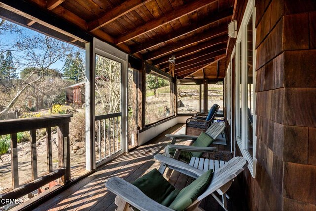sunroom with beamed ceiling