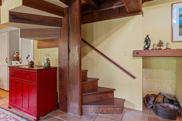 stairway featuring tile patterned floors