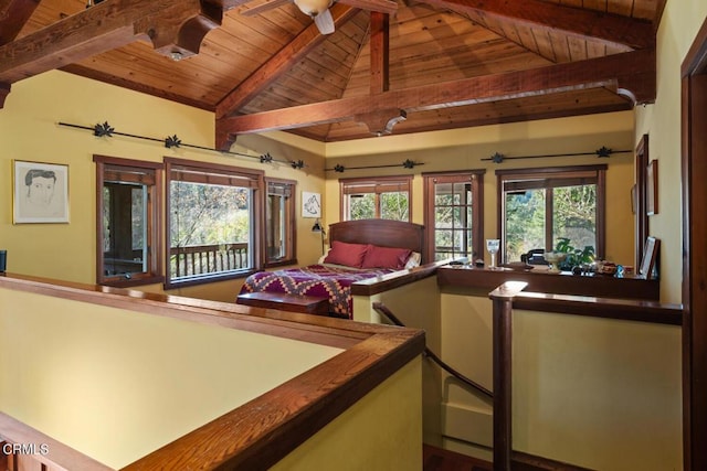 bedroom with wooden ceiling, lofted ceiling with beams, and multiple windows