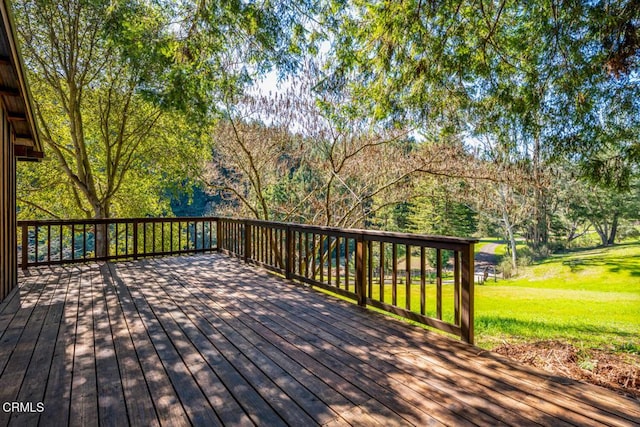 wooden deck with a yard
