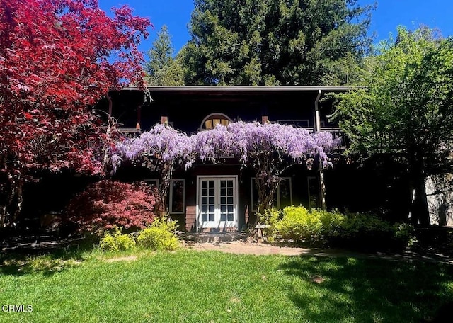 view of outbuilding featuring french doors