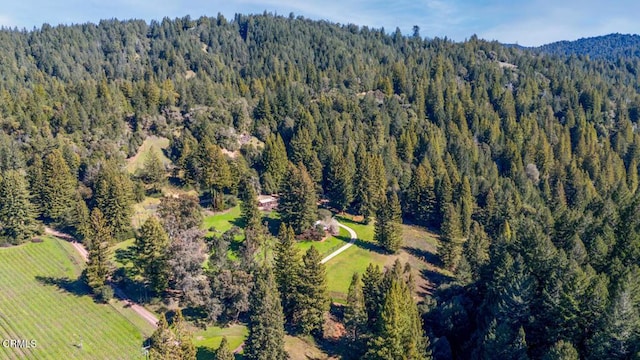drone / aerial view with a view of trees