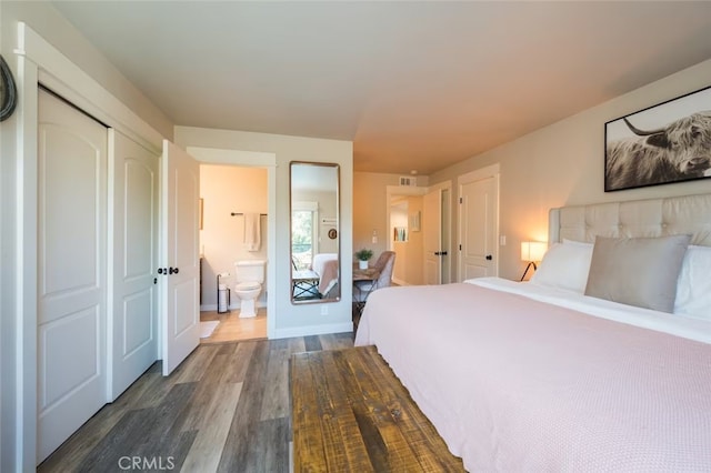 8035 Santa Rosa Rd, Atascadero, CA 93422 - bedroom featuring dark wood finished floors, ensuite bath, and baseboards