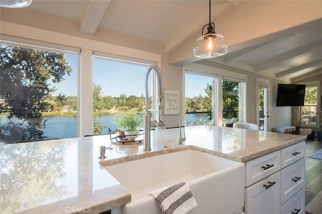 8035 Santa Rosa Rd, Atascadero, CA 93422 - kitchen with a sink, pendant lighting, white cabinets, light stone countertops, and open floor plan