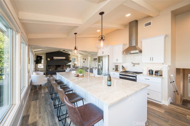 8035 Santa Rosa Rd, Atascadero, CA 93422 - kitchen with wall chimney range hood, stainless steel appliances, open floor plan, a sink, and tasteful backsplash