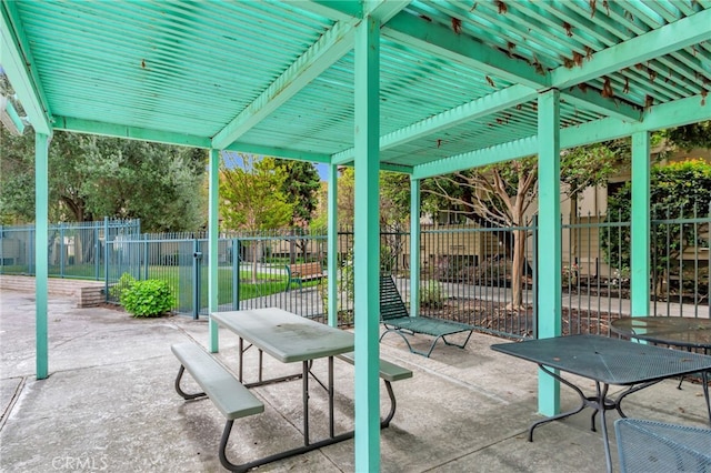 view of patio featuring fence