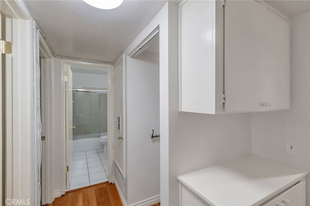 corridor featuring light wood-style flooring