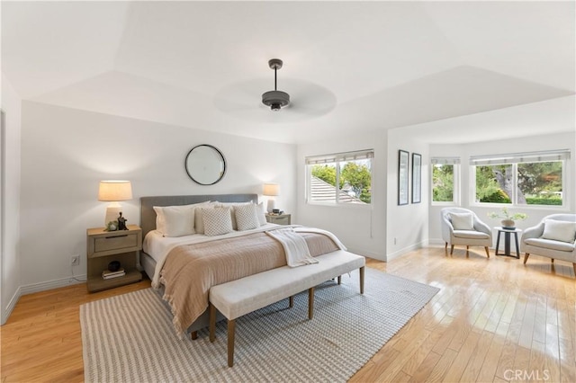 10 Cedarlake Unit 4, Irvine, CA 92614 - bedroom with ceiling fan, baseboards, a tray ceiling, and light wood-style flooring