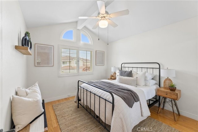 10 Cedarlake Unit 4, Irvine, CA 92614 - bedroom with lofted ceiling with beams, baseboards, wood finished floors, and ceiling fan