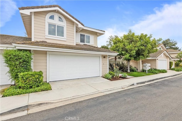 10 Cedarlake Unit 4, Irvine, CA 92614 - traditional-style house with an attached garage, a tile roof, and concrete driveway